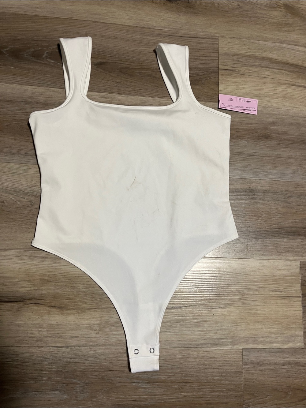 White One-Piece Bodysuit with Snap Closure